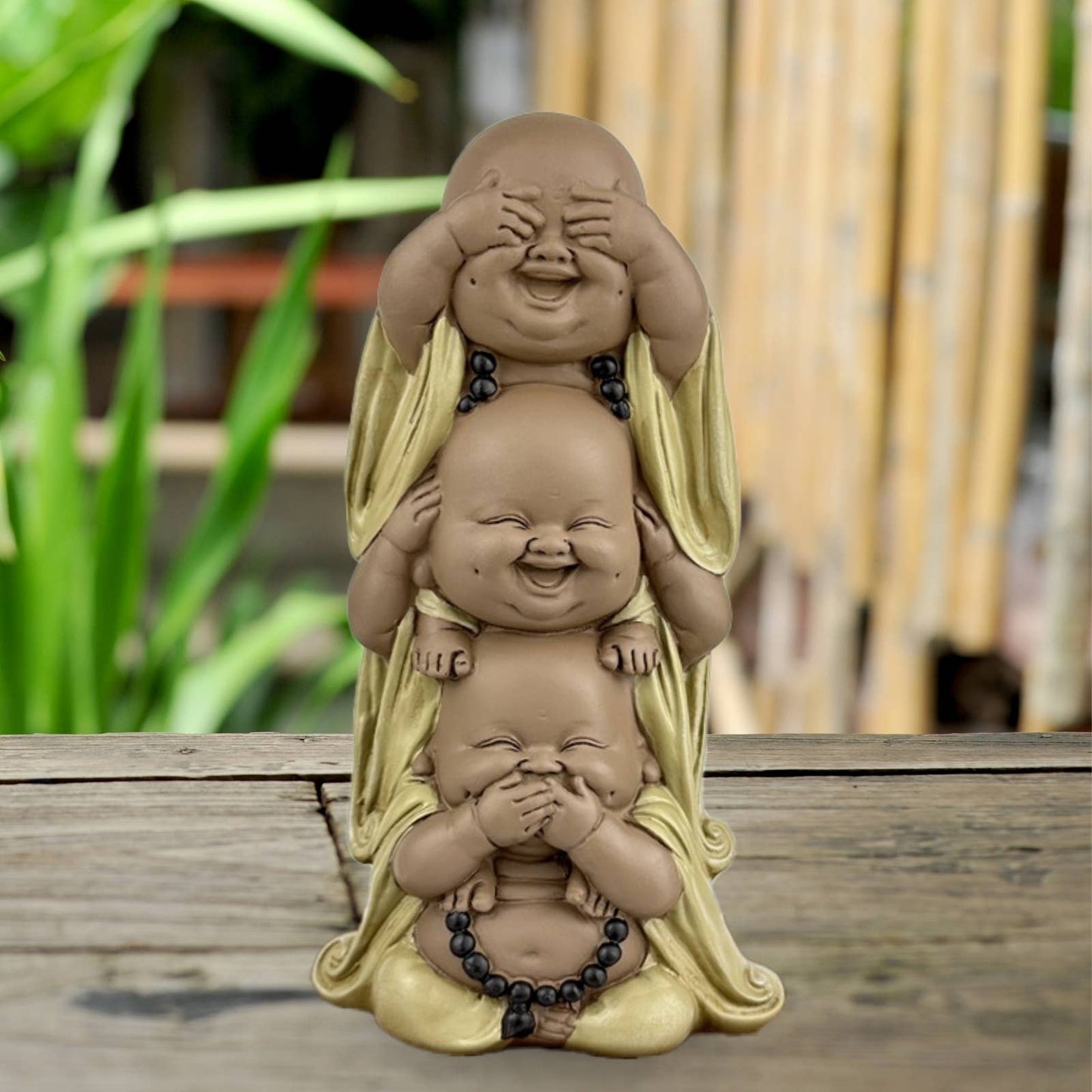 Tre Buddha figurer