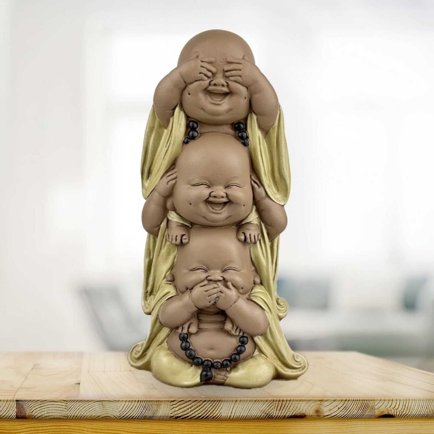Tre Buddha figurer